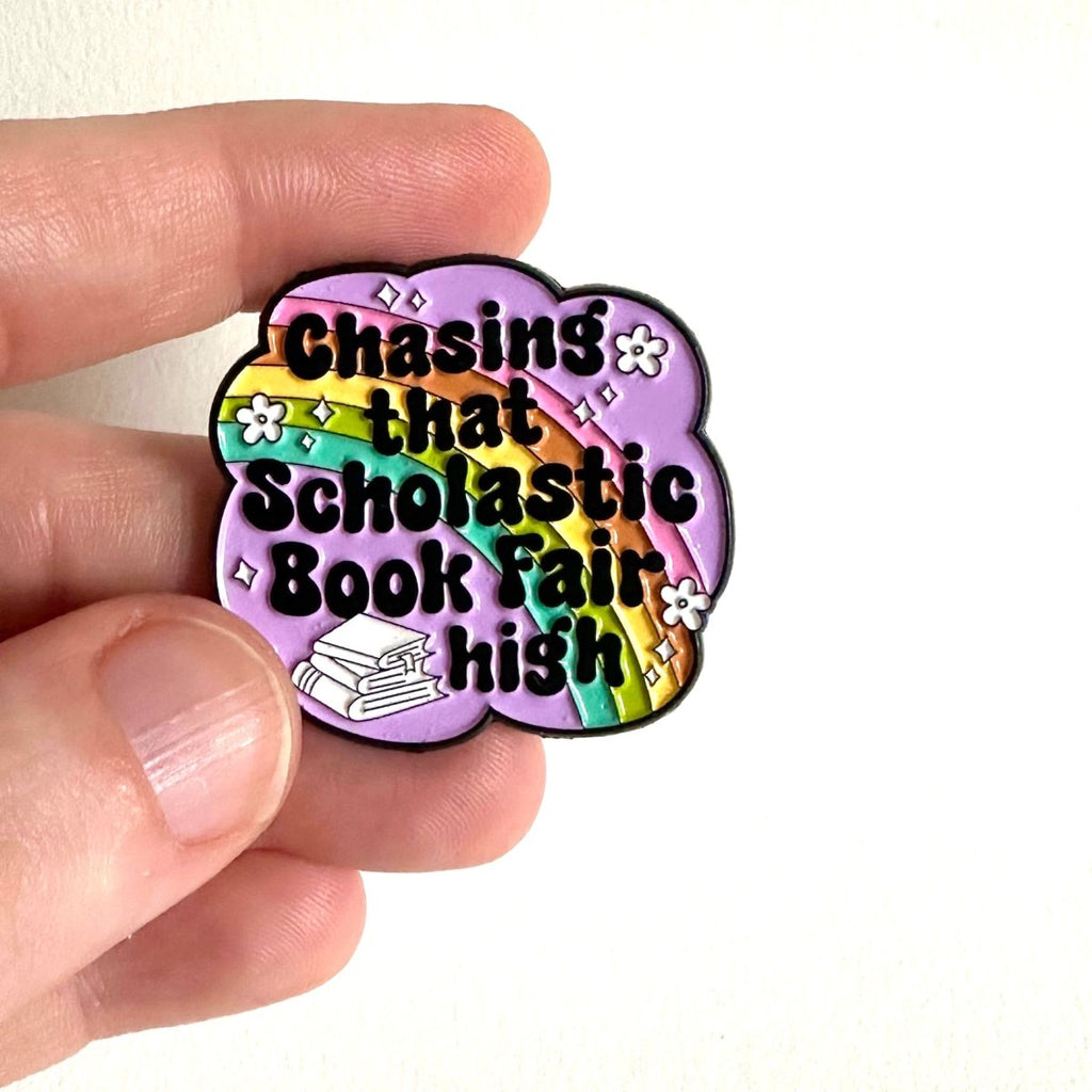 Chasing That Scholastic Book Fair High Enamel Pin, 1.3” x 1.3”