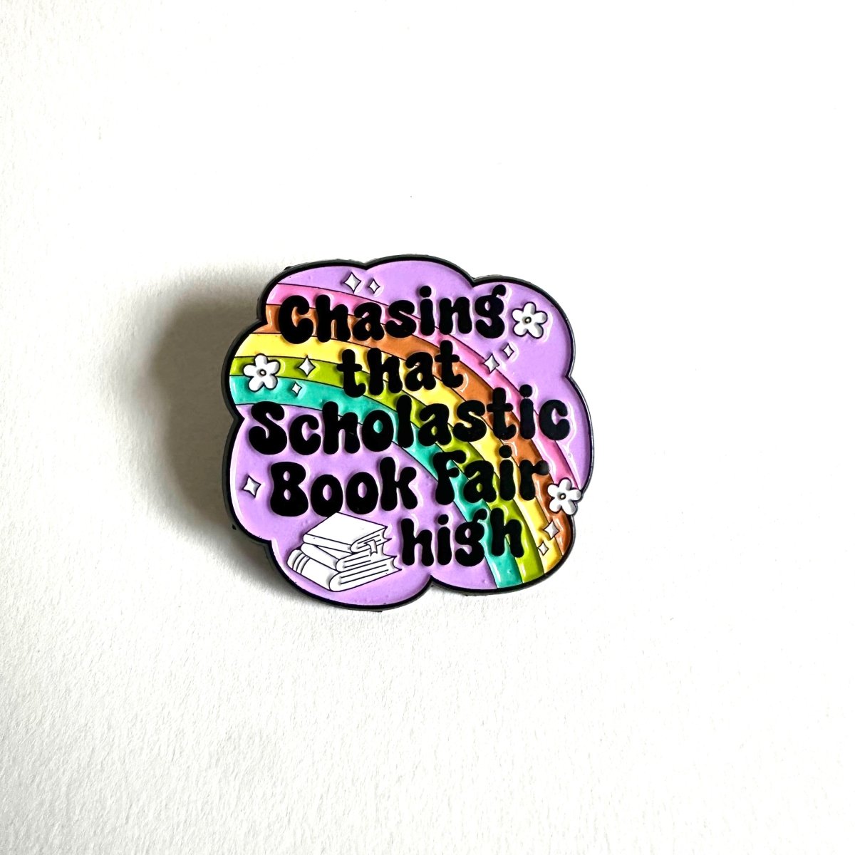 Chasing That Scholastic Book Fair High Enamel Pin, 1.3” x 1.3”