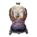 Spooky Spinning Waterglobe held by Skeleton Hands