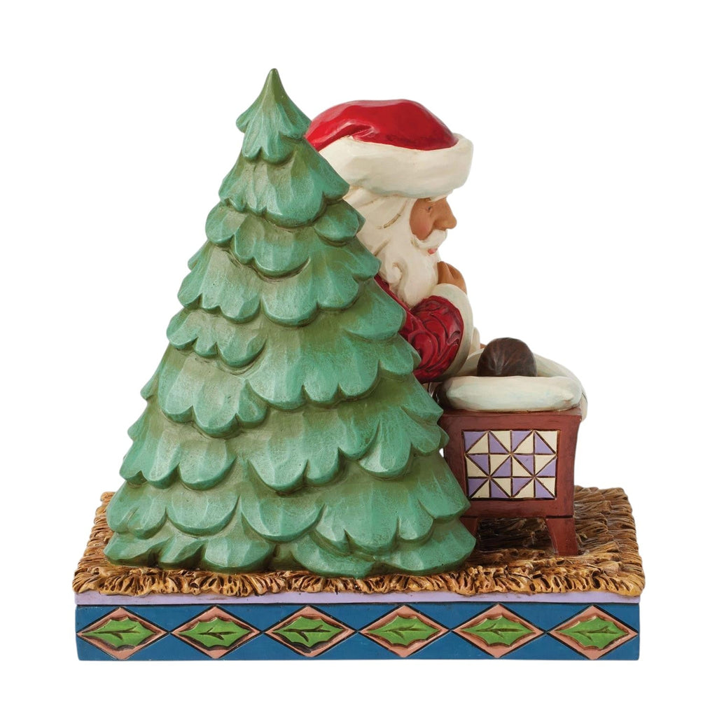 Santa Kneeling over Baby Jesus