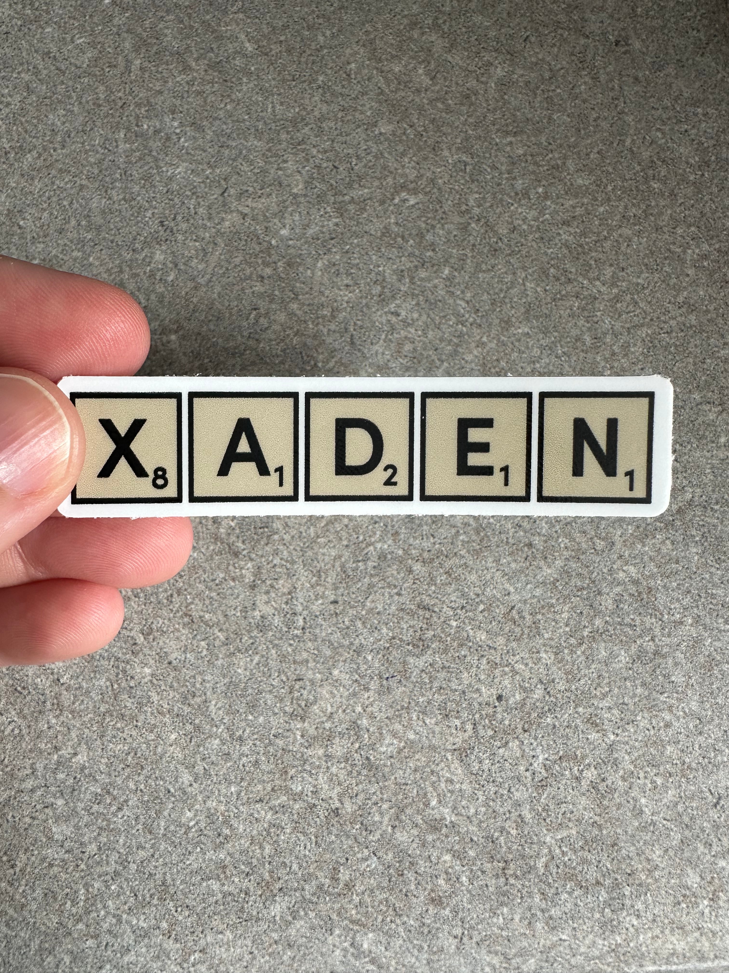 Xaden Game Tiles Vinyl Sticker, 3.0” x 0.68”