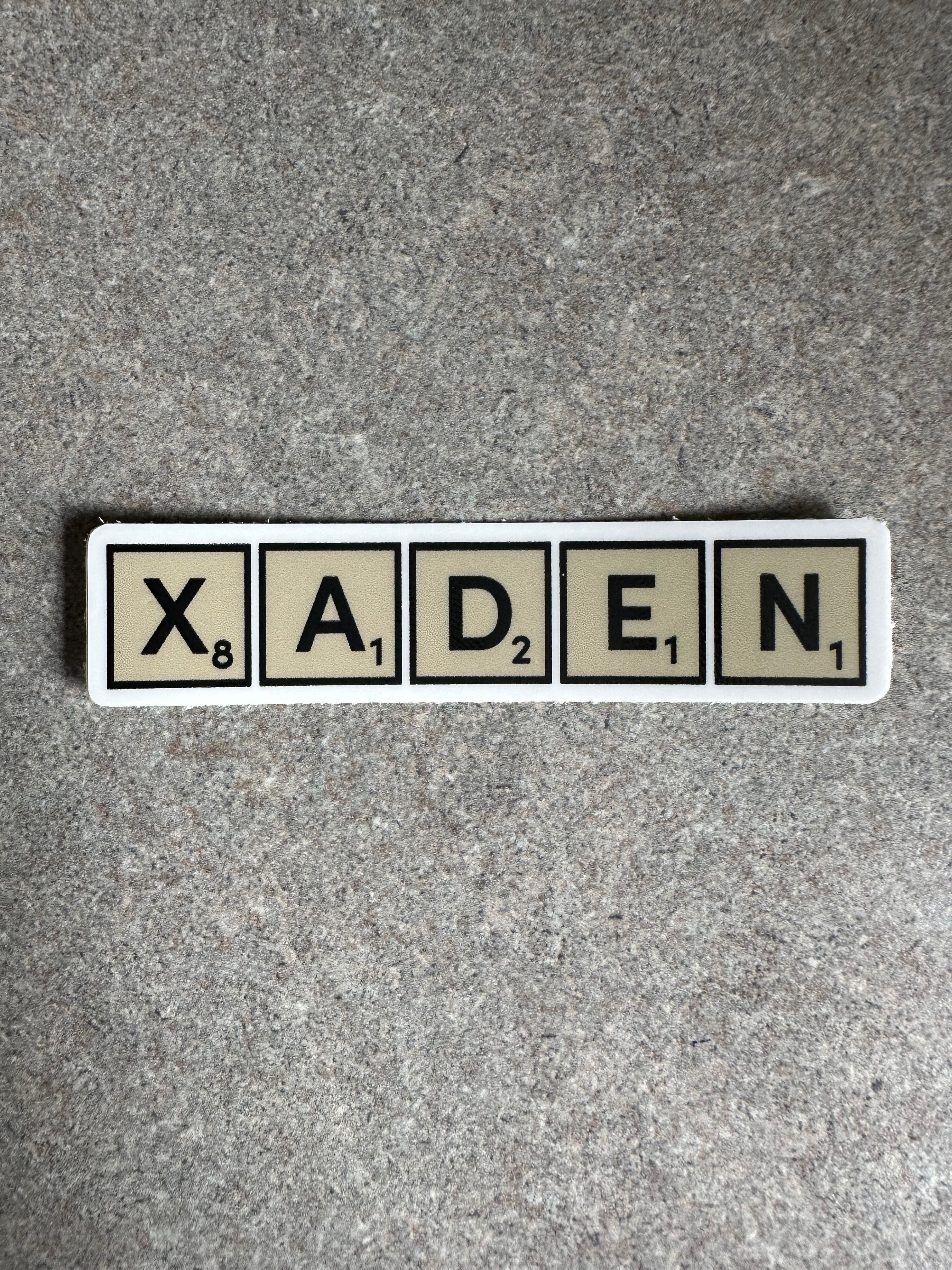 Xaden Game Tiles Vinyl Sticker, 3.0” x 0.68”